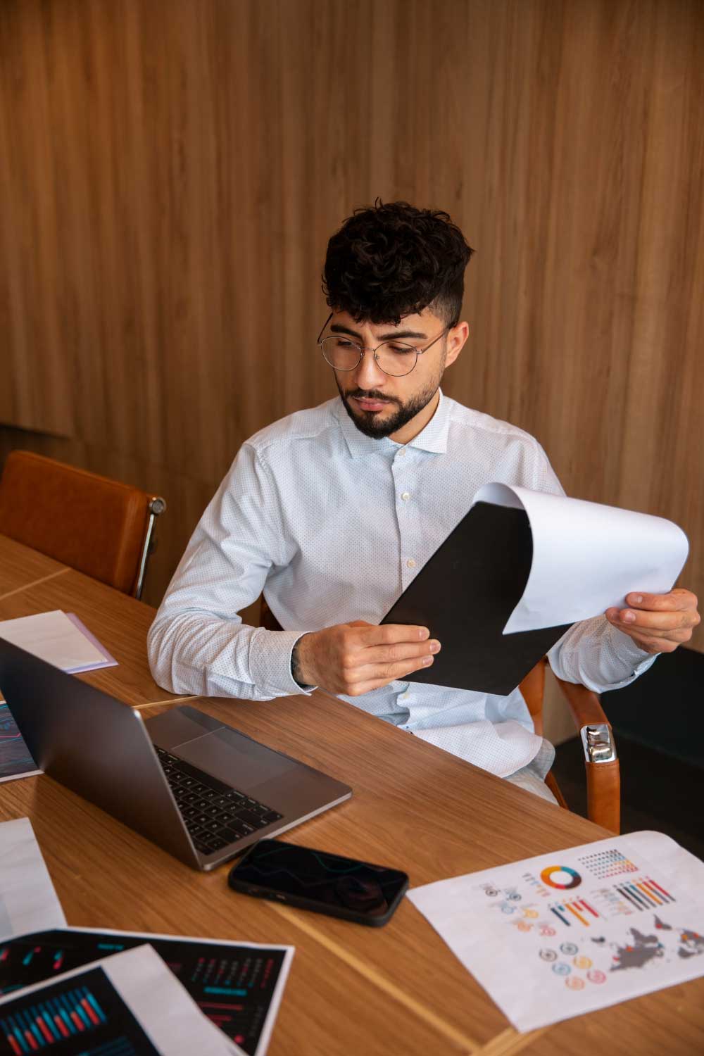 Smiling accounting professional presenting financial reports during a client meeting, showcasing expert cpa boca raton accounting services