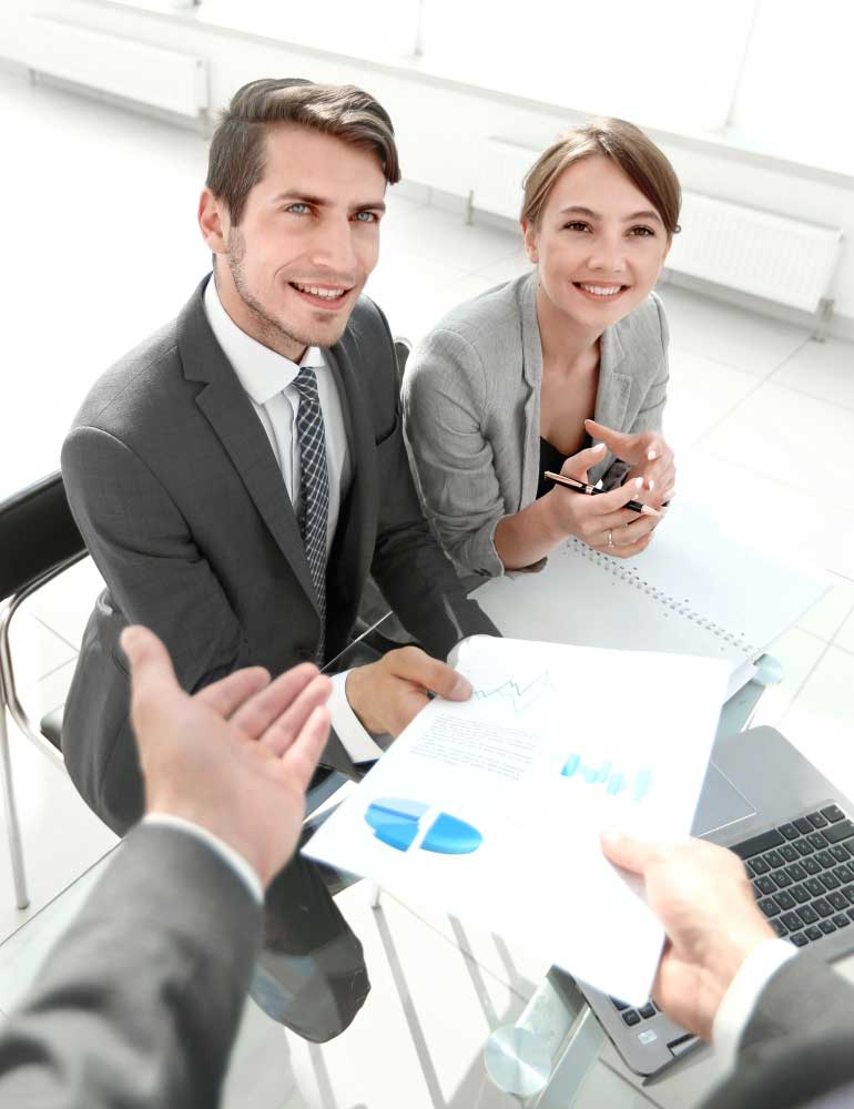 Business professionals reviewing financial charts during a client consultation, delivering trusted cpa boca raton accounting services